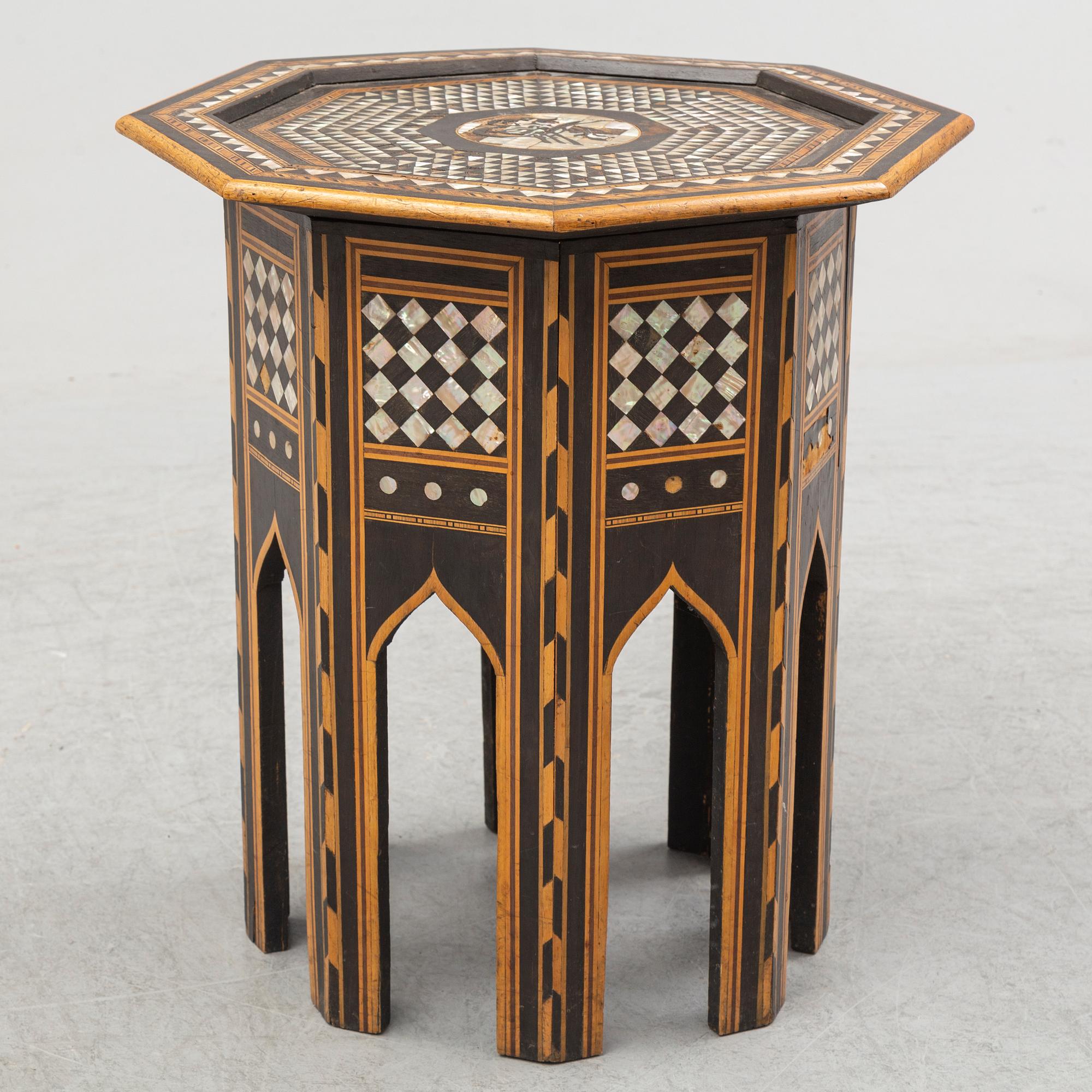 A mother of pearl and wood small table, 20th century.