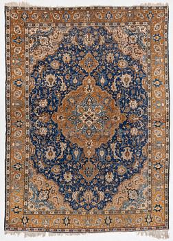 A Tabriz carpet, semi-antique, c. 400 x 295 cm.