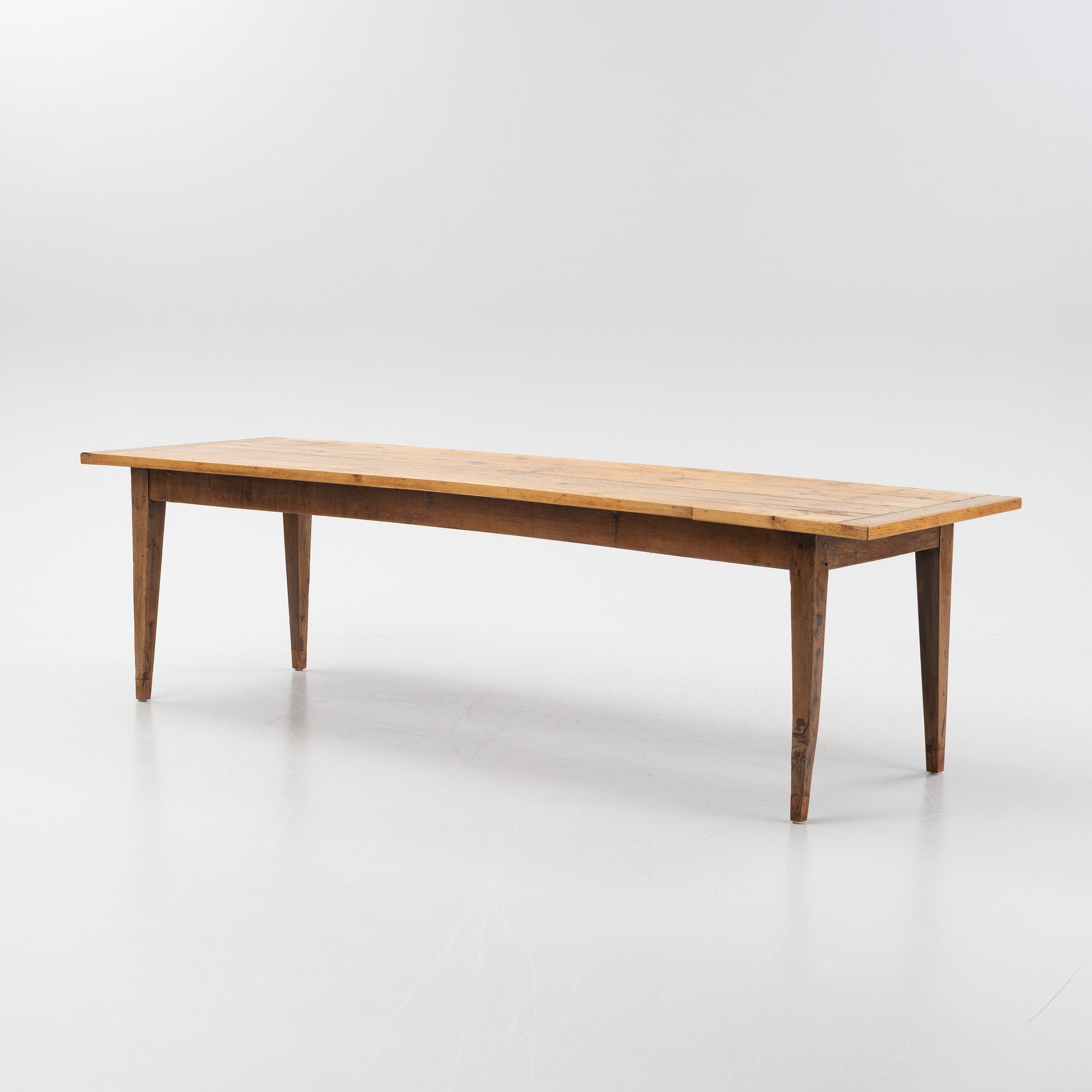 A contemporary French country style dining table.