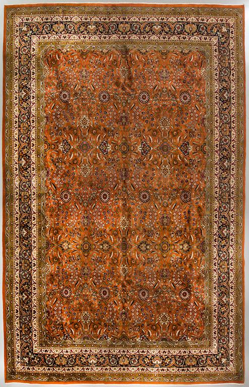 An old Kirman carpet ca 408 x303 cm.