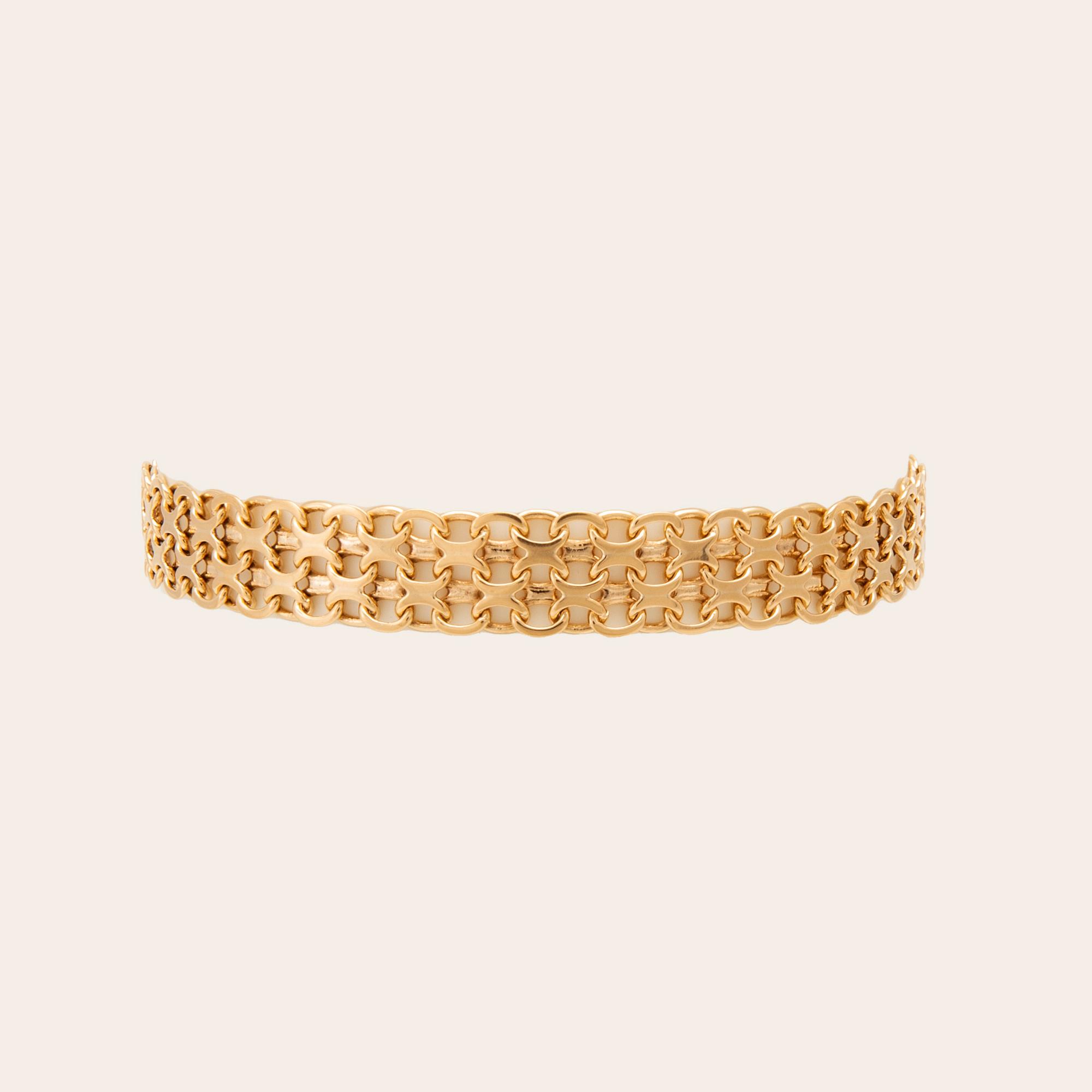 An 18K gold x-link bracelet.