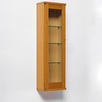 James Krenov, an oak or doussie showcase wall cabinet, executed in his own workshop, Bromma, Sweden.
