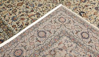 A Keshan carpet, signed, approx. 410 x 323 cm.