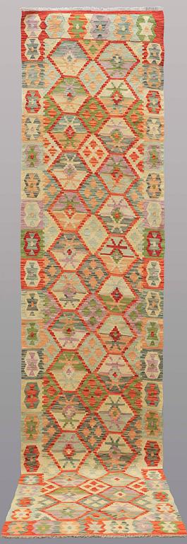 A runner kilim, ca 391 x 88 cm.