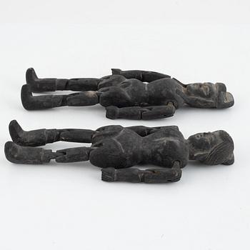 A pair of Chinese wooden dolls, early 20th century.
