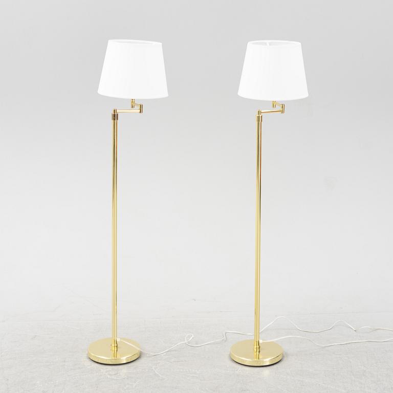 A pair of brass floor lamps, 1960's/70's.