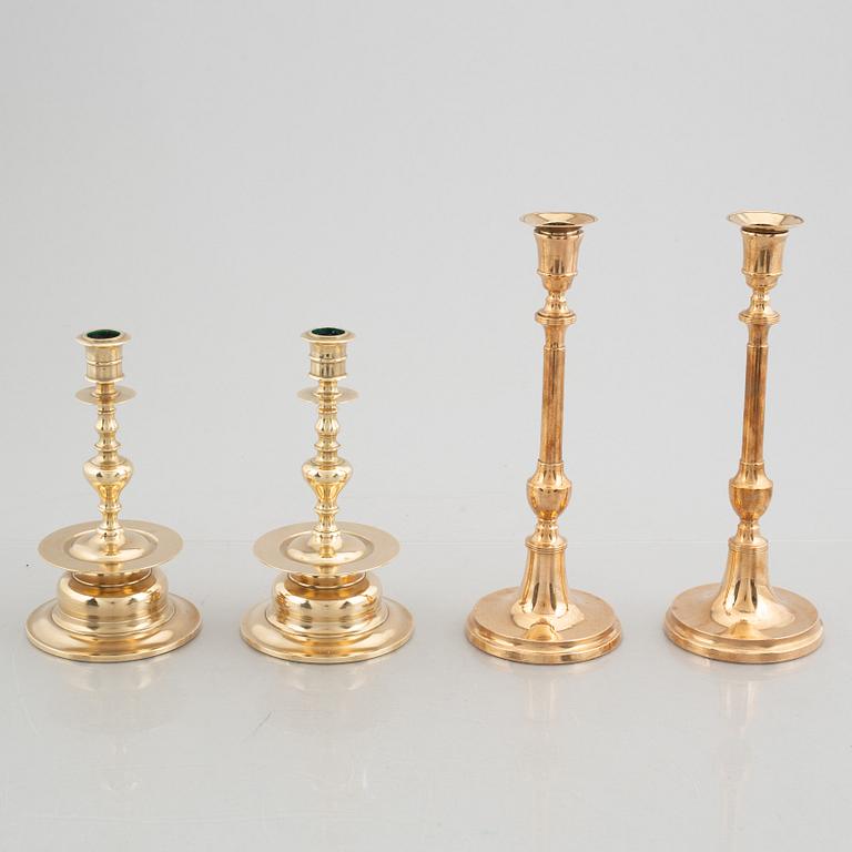 Two pairs of brass candlesticks, 19th century - early 20th century.