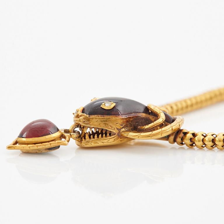 A 14K gold necklace set with garnets and rose-cut diamonds.