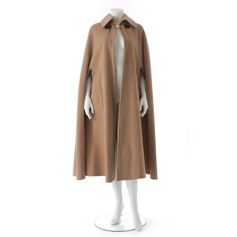 CÉLINE, a beige wool blend cape.