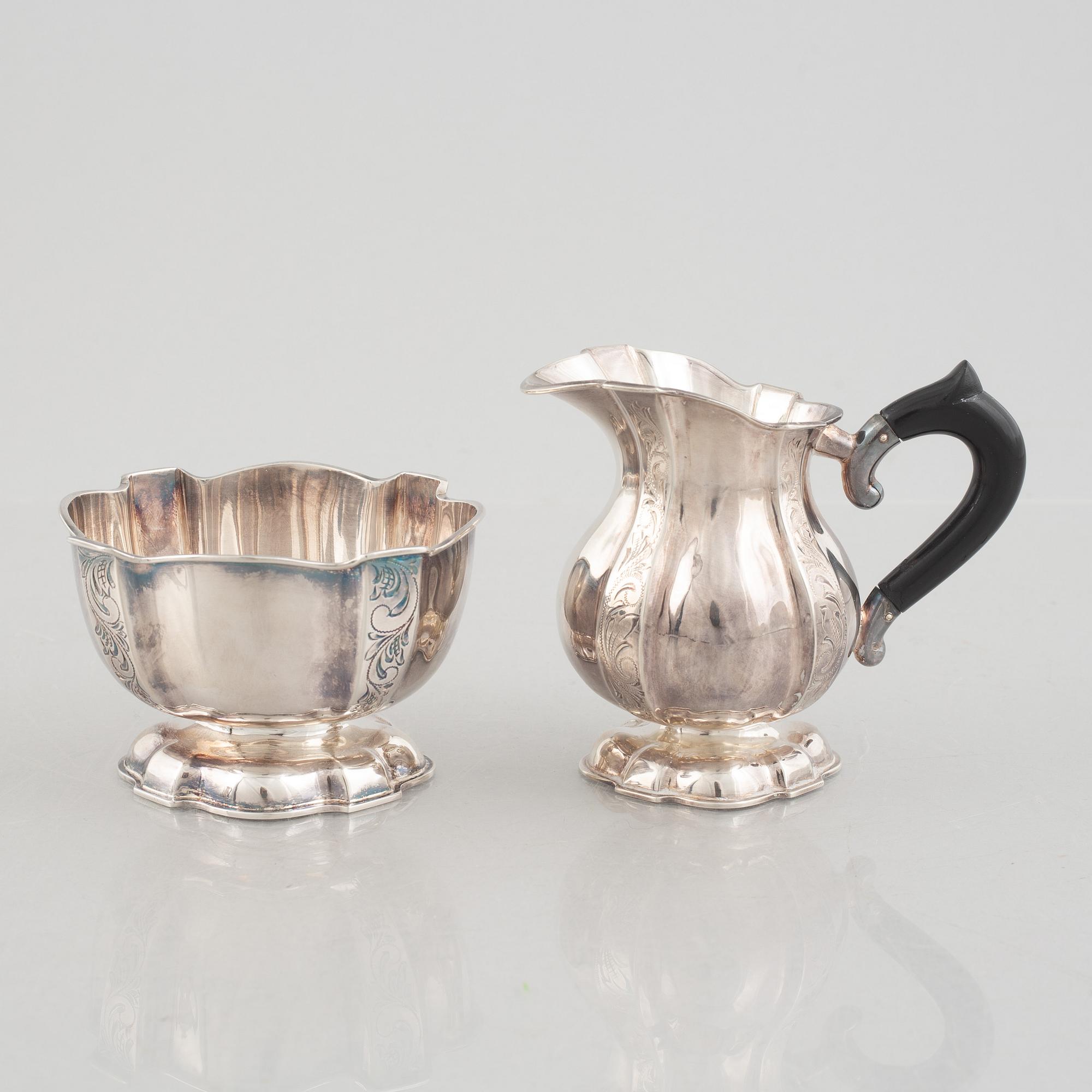A silver coffee pot, creamer and sugarbowl, Swedish import marks, JL Hultman, circa mid-20th century.