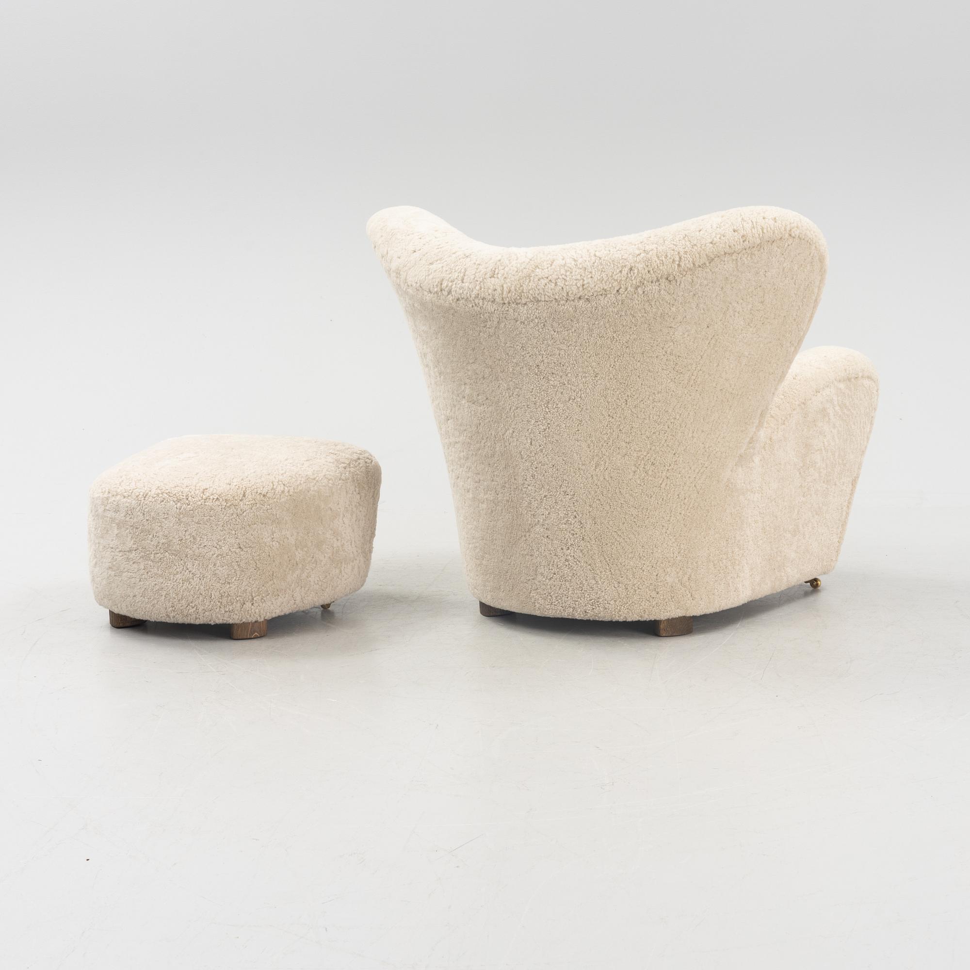 A 'The tired man' lounge chair with stool by Flemming Lassen by Lassen, designed 1935.