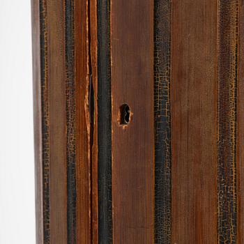 A Swedish Empire column-shaped cabinet, first part 19th century.