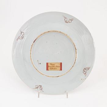 A pair of Chinese plates, a serving dish and a cream jug, Qing dynasty, 18th Century.