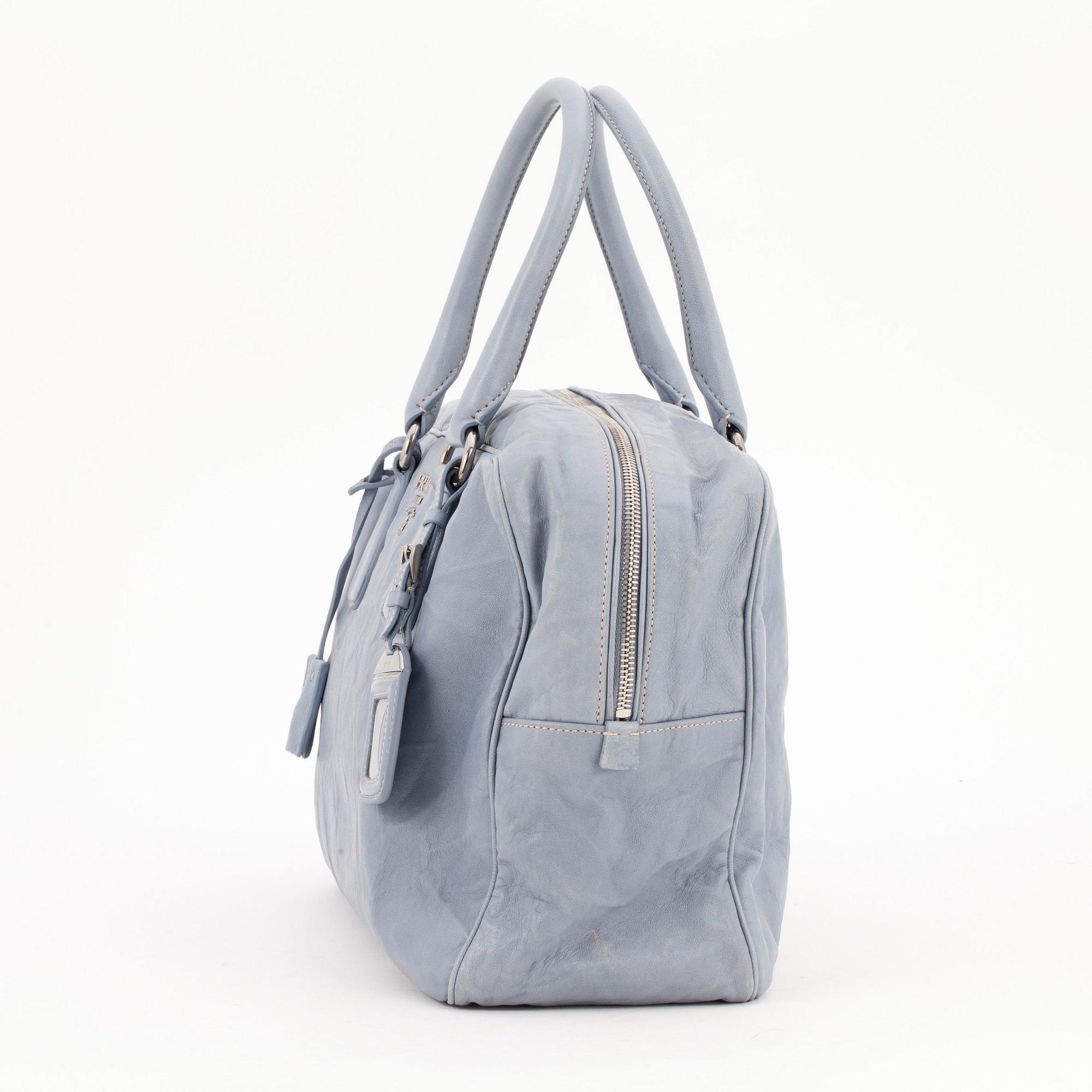 PRADA, a pale blue leather purse.