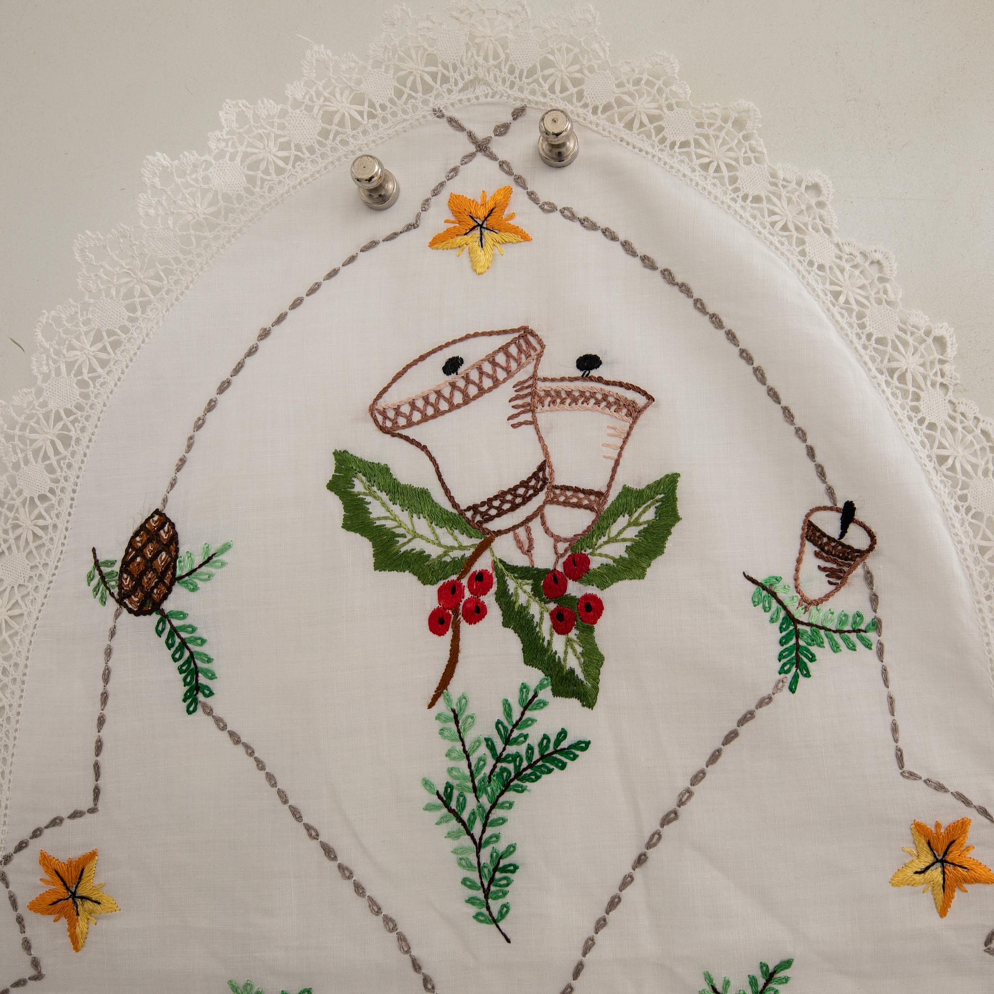 A collection of smaller Christmas tablecloths, runners, and wall hangings, approximately 34 pieces, mid/second half of the 20th century.