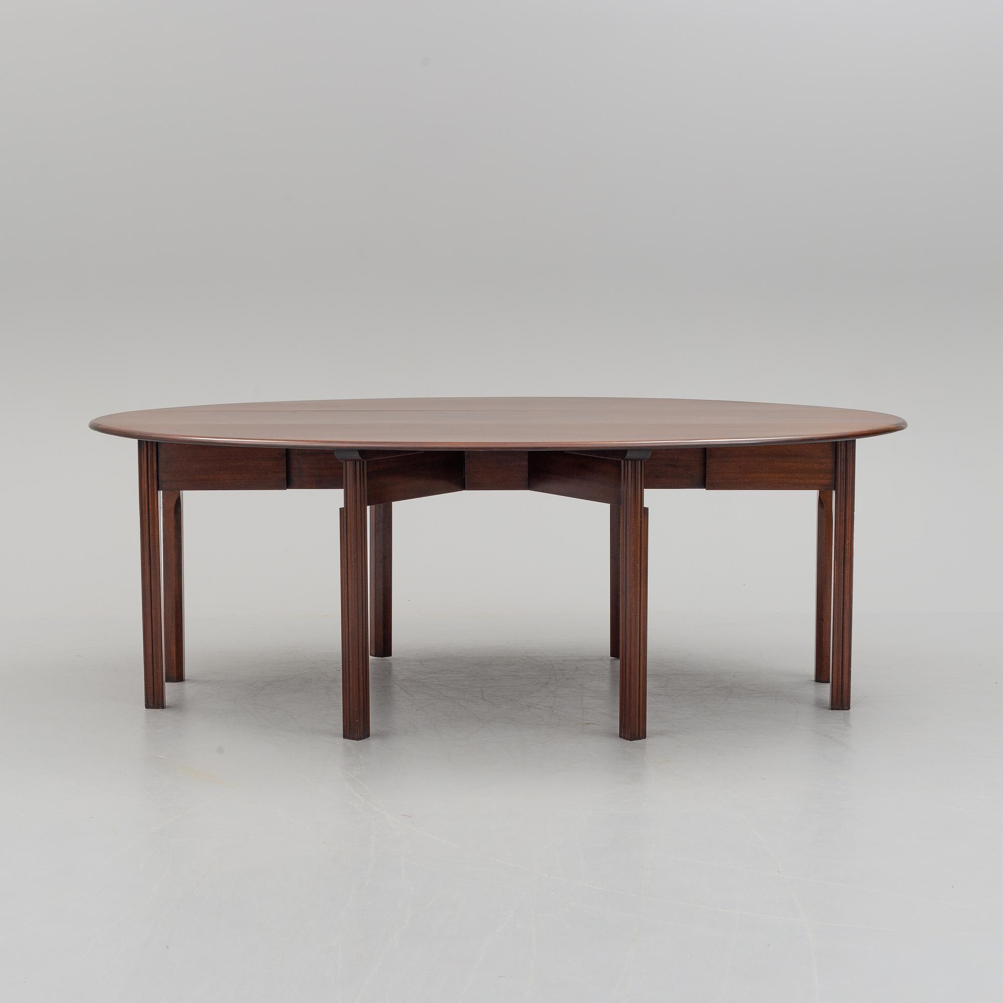 A DINING TABLE, England, made for NK, Nordiska Kompaniet, Sweden. Signed with label. Probably 1960s / 70s.