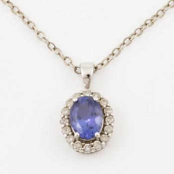 Pendant in 14K white gold set with a faceted tanzanite and round brilliant-cut diamonds.