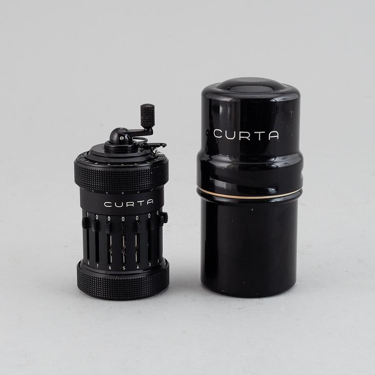 A 'Curta, Type I' calculator developed by Curt Herzstark, Contina AG Mauren, Lichtenstein, designed in 1947.