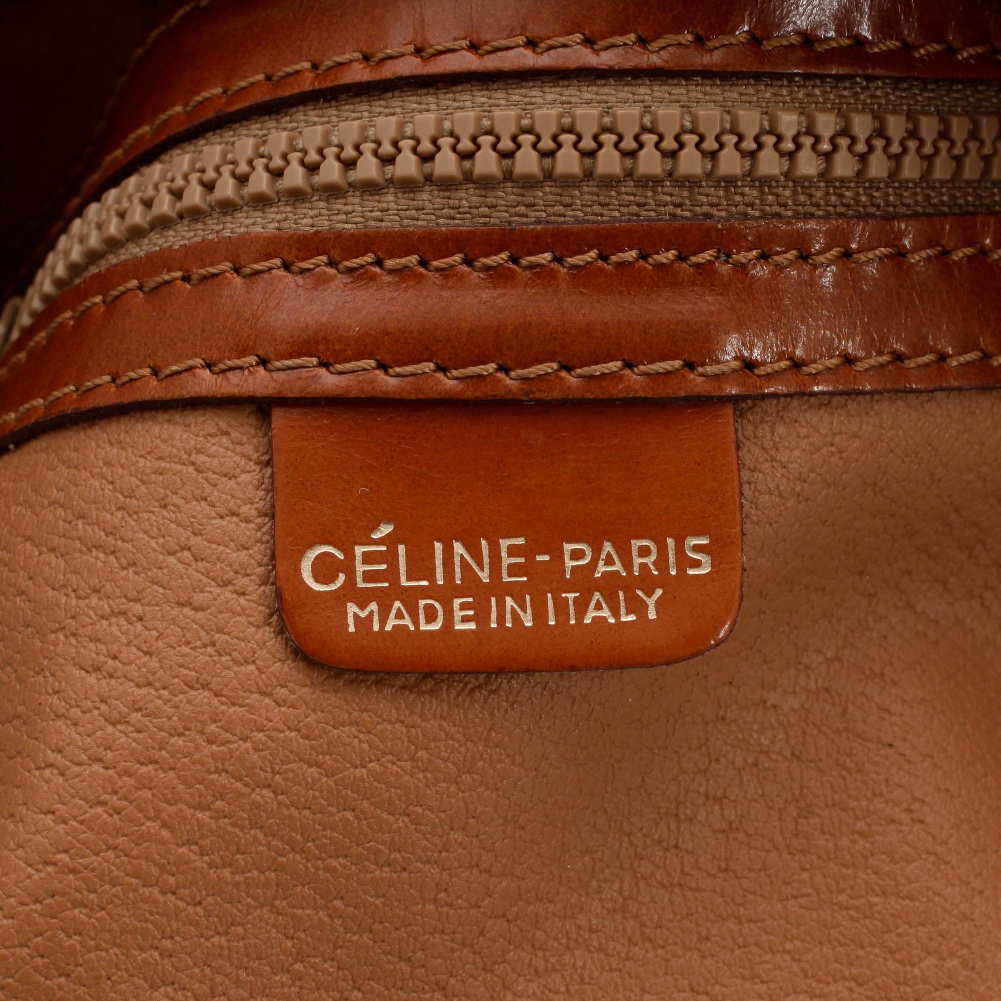 CÉLINE, a leather and canvas shoulder bag.