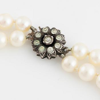 Cultured two strand pearl necklace, clasp silver with paste.