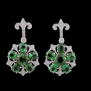 1082. A pair of green tourmaline and brilliant-cut diamond earrings.