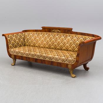 A circa 1900 sofa, two easy chairs and a table.