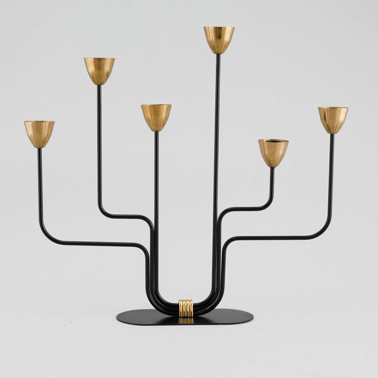 A candelabrum and one camdelstick by Gunnar Ander for Ystad Metall, 20th century.