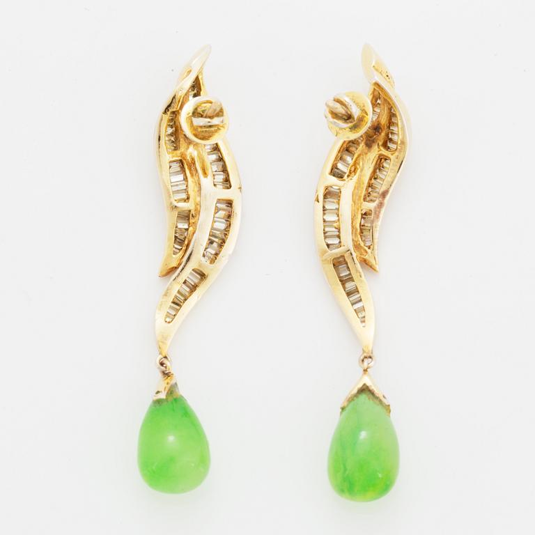 Baguette cut diamond and green stone earrings.
