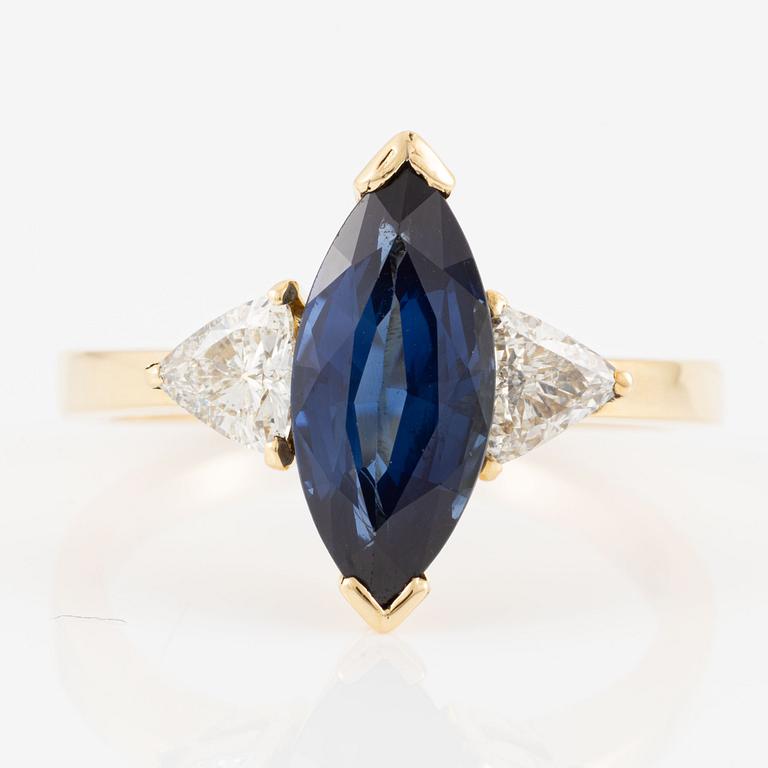 Ring, 18K gold with navette-shaped sapphire and triangle-cut diamonds.