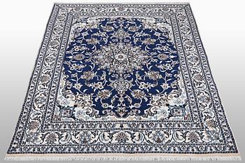A carpet, Nain, part silk, ca 202 x 148 cm.