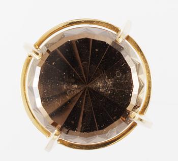 A Claes Giertta 18 k gold and facet cut smokey quartz, Stockholm 1963.