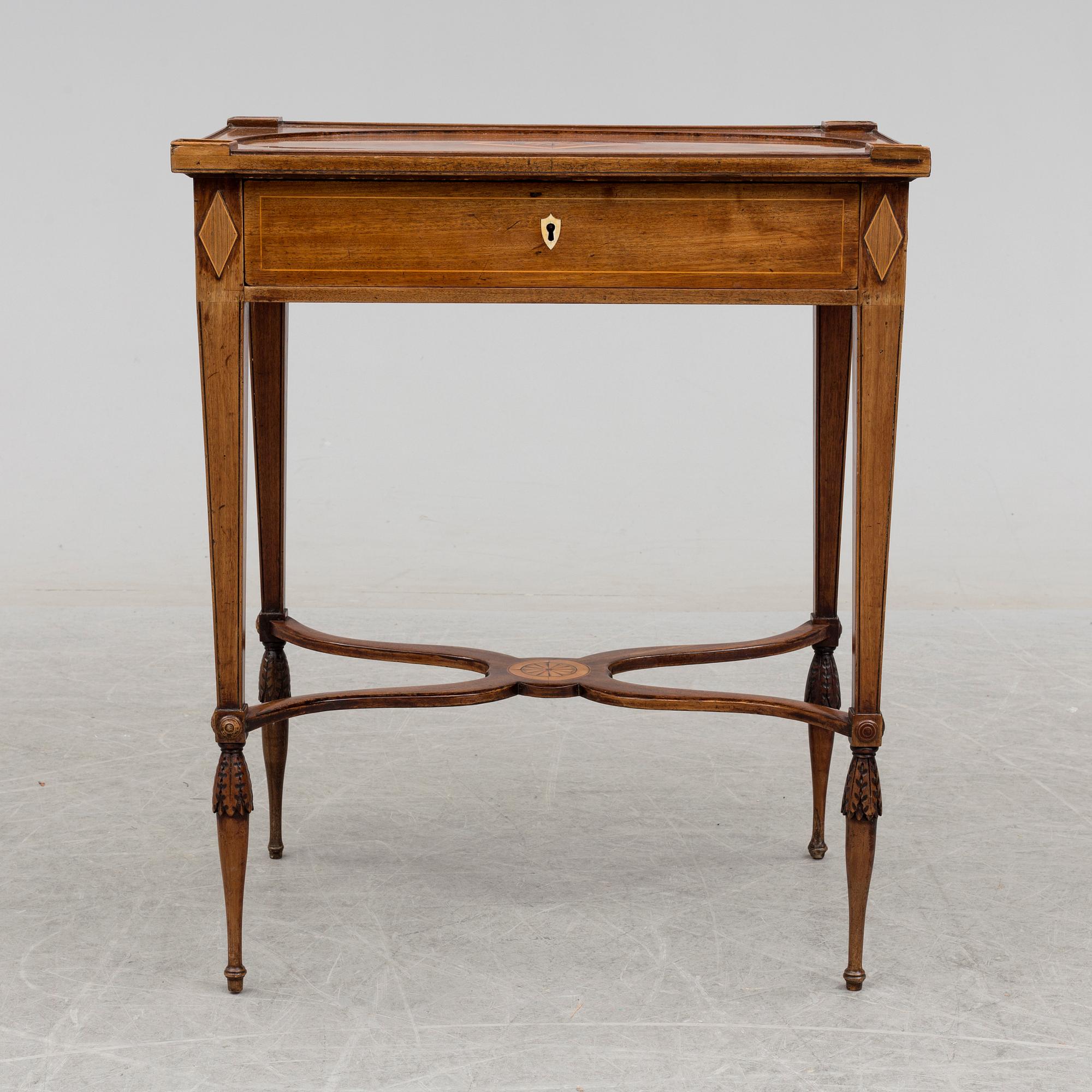 A circa 1800 table in the style of Lars Qvarnberg.