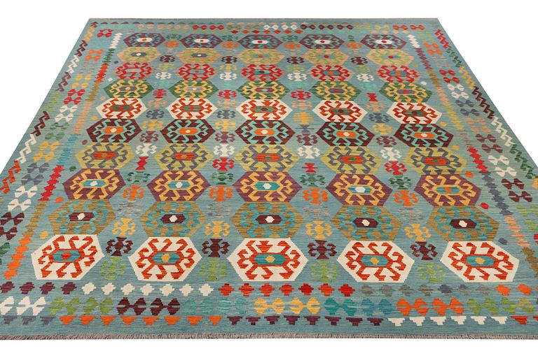 A Kilim carpet, c. 392 x 312 cm.