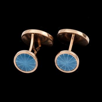 A pair of blue enamel and diamond cufflinks.