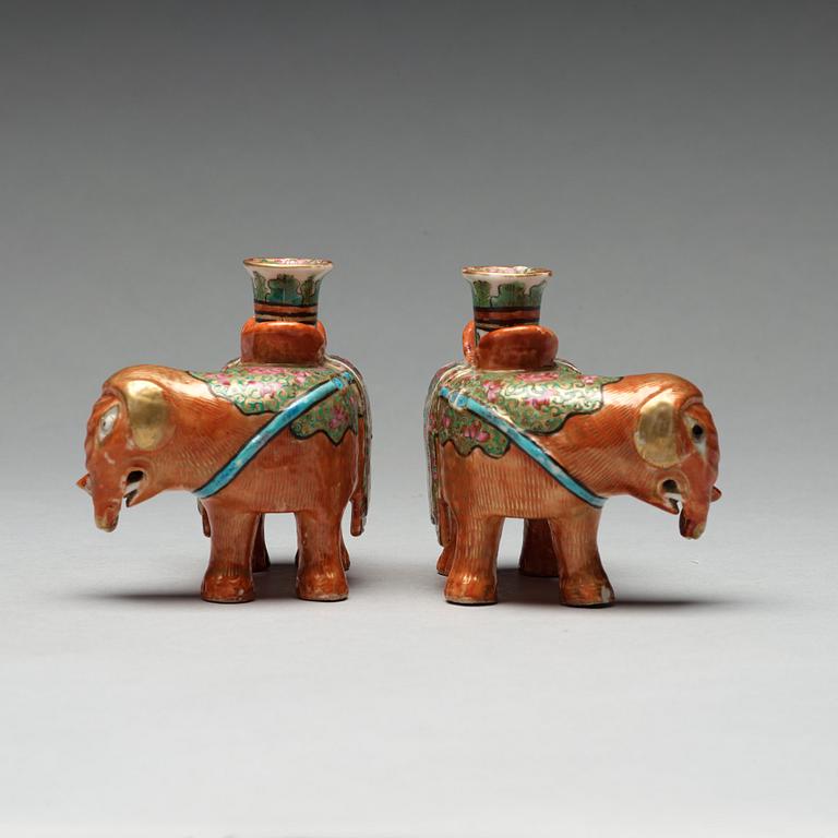 A pair of Canton candle sticks in the shape of elephants, Qing dynasty, 19th century.
