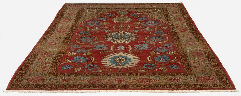 A Qum carpet, Central Persia, c. 310 x 190 cm.