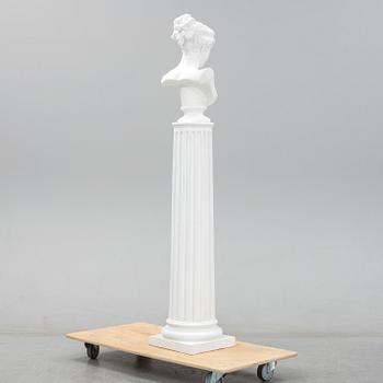 A plaster bust and pedestal.