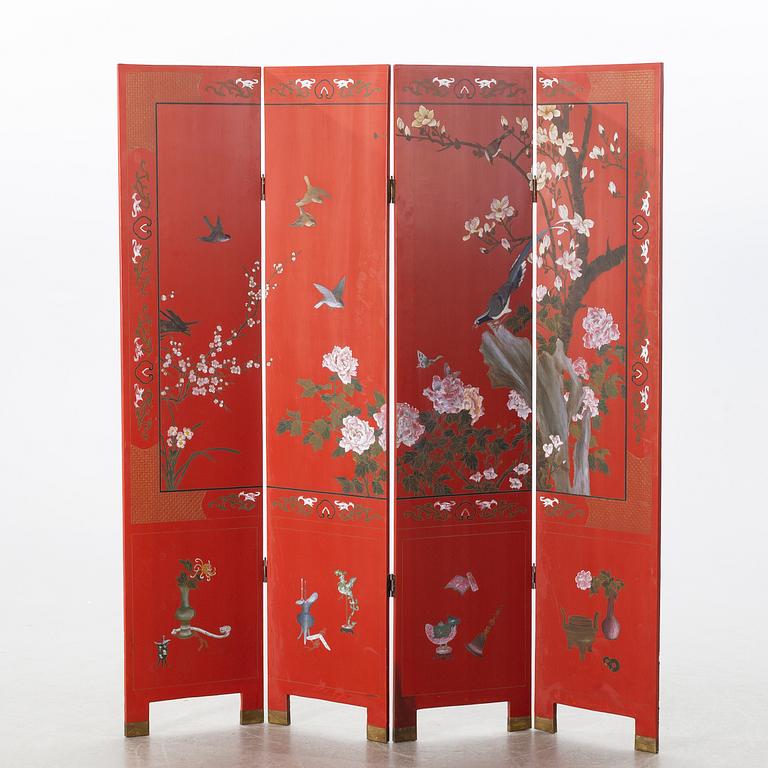 A Chinese lacquered folding screen, 20th century.