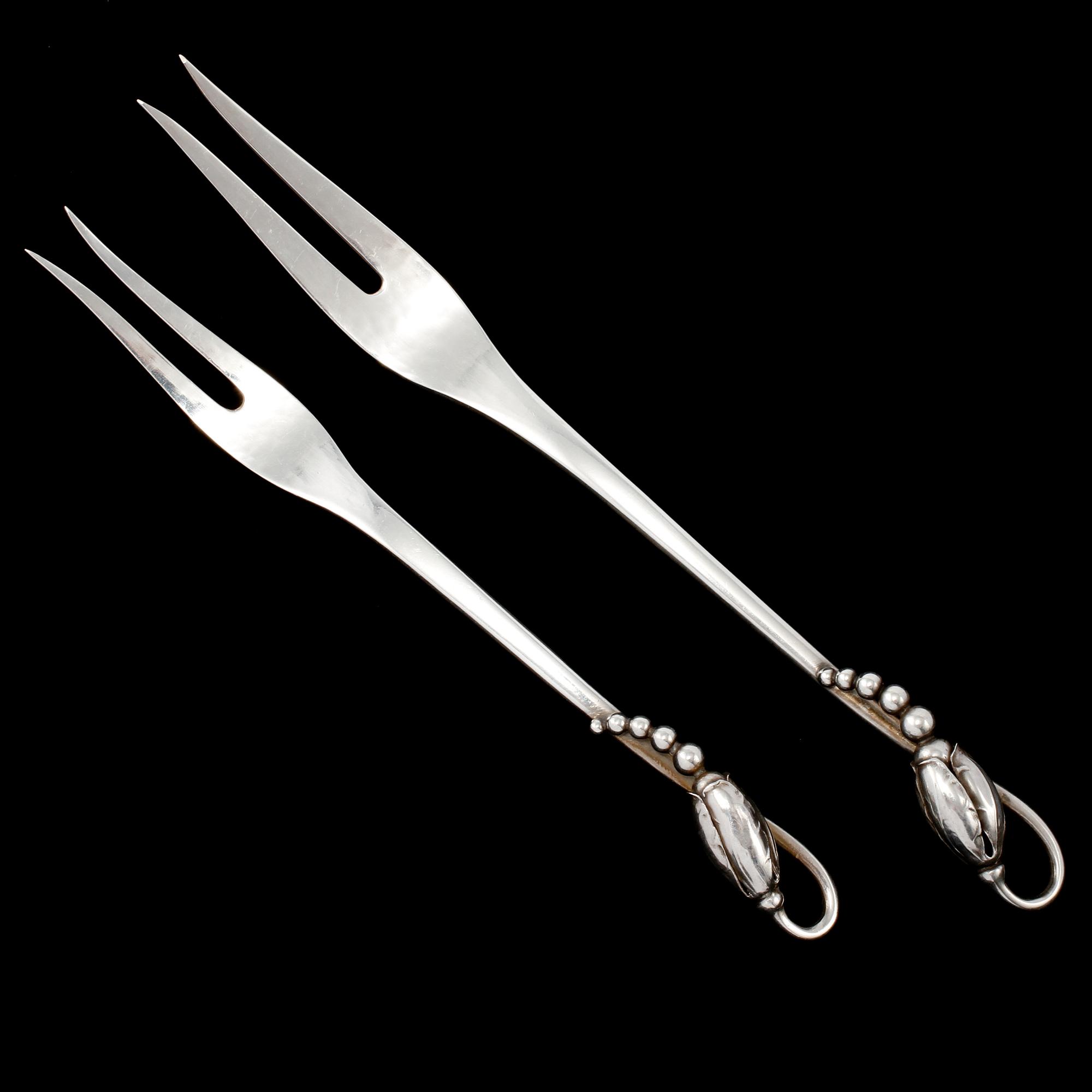 SERVERINGSBESTICK, 2 st, sterlingsilver, "Magnolia/Blossom", Georg Jensen, Danmark. Vikt 40 g.