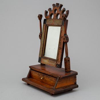 An early 19th century drawer with mirror.