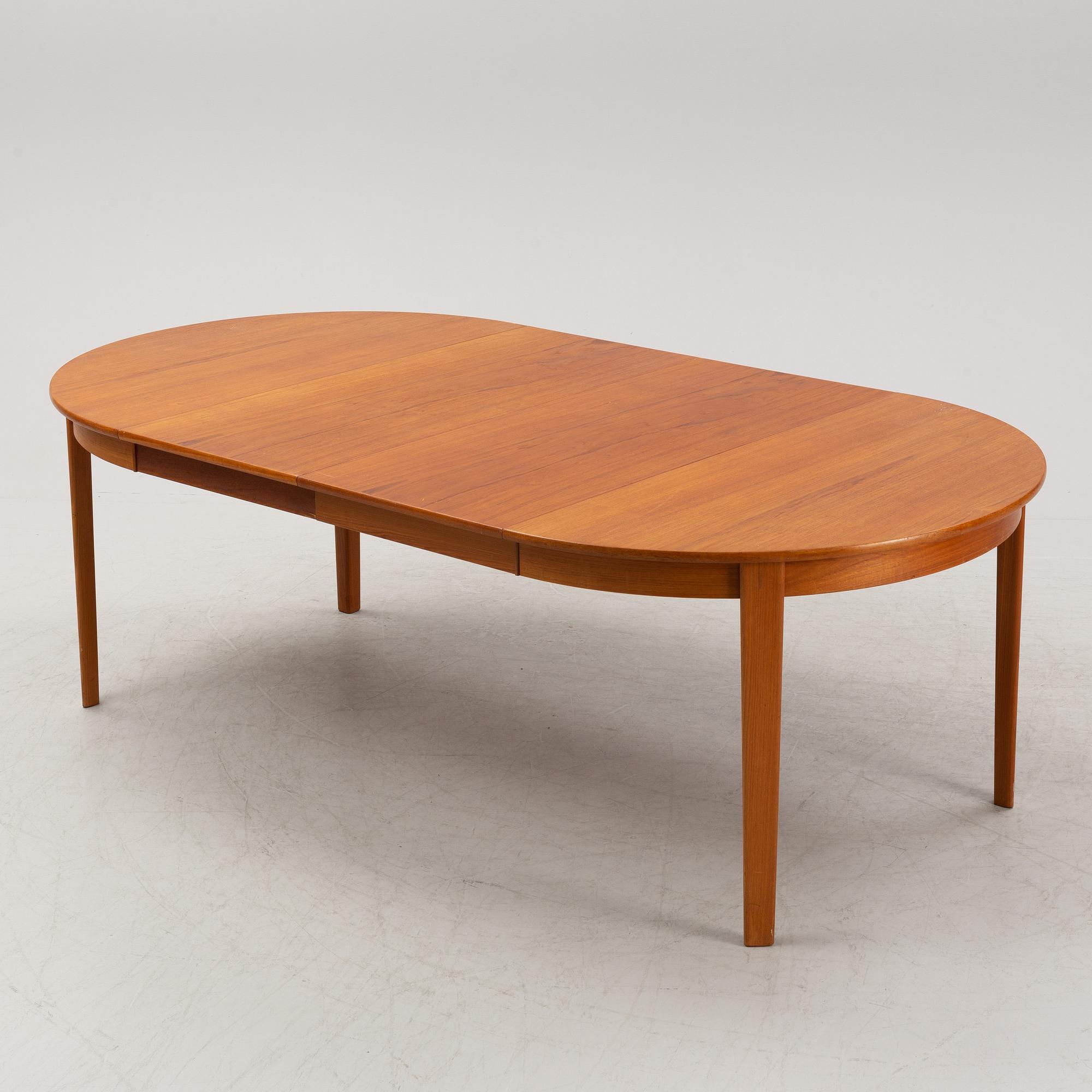 A 1950's/60's teak-veneered dining table.