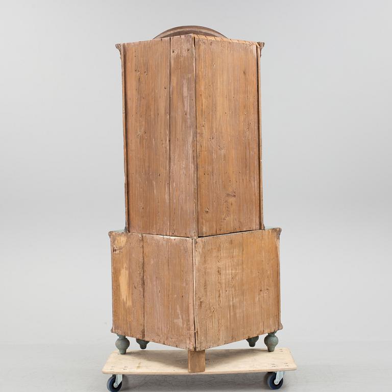A 18th century corner cabinet.