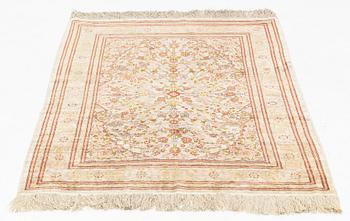 A Hereke silk rug, c. 130 x 87 cm.
