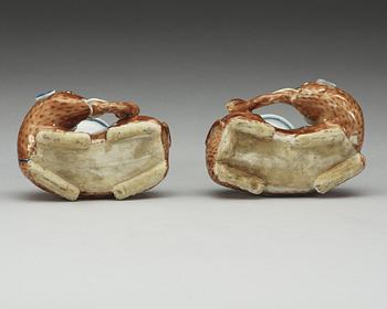 A pair of Export candle sticks in the shape of reclining elephants, Qing dynasty, Qianlong (1736-95).