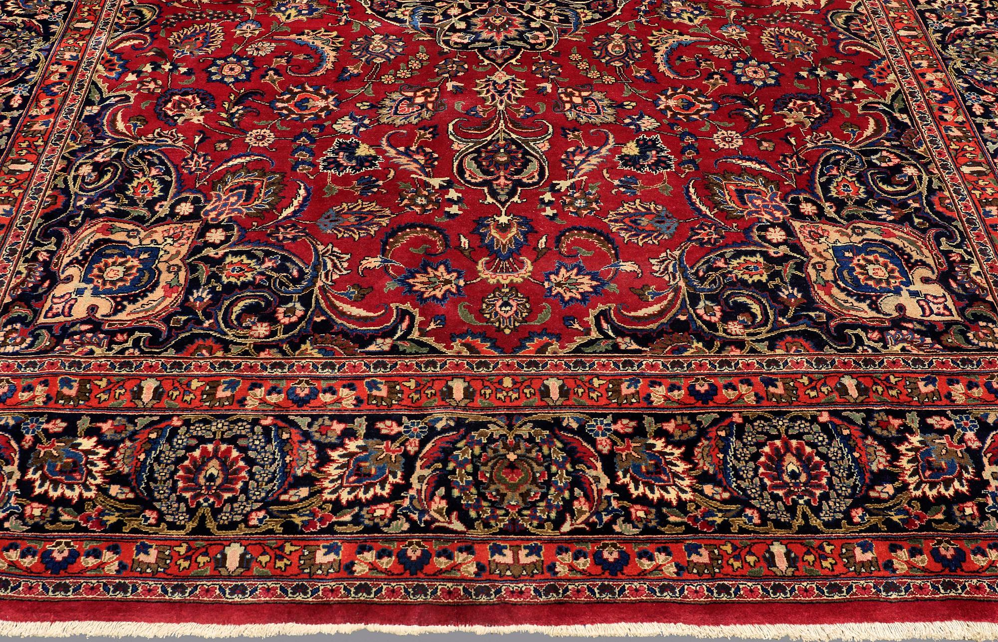 A CARPET, Mashad, signed, ca 385 x 293 cm.