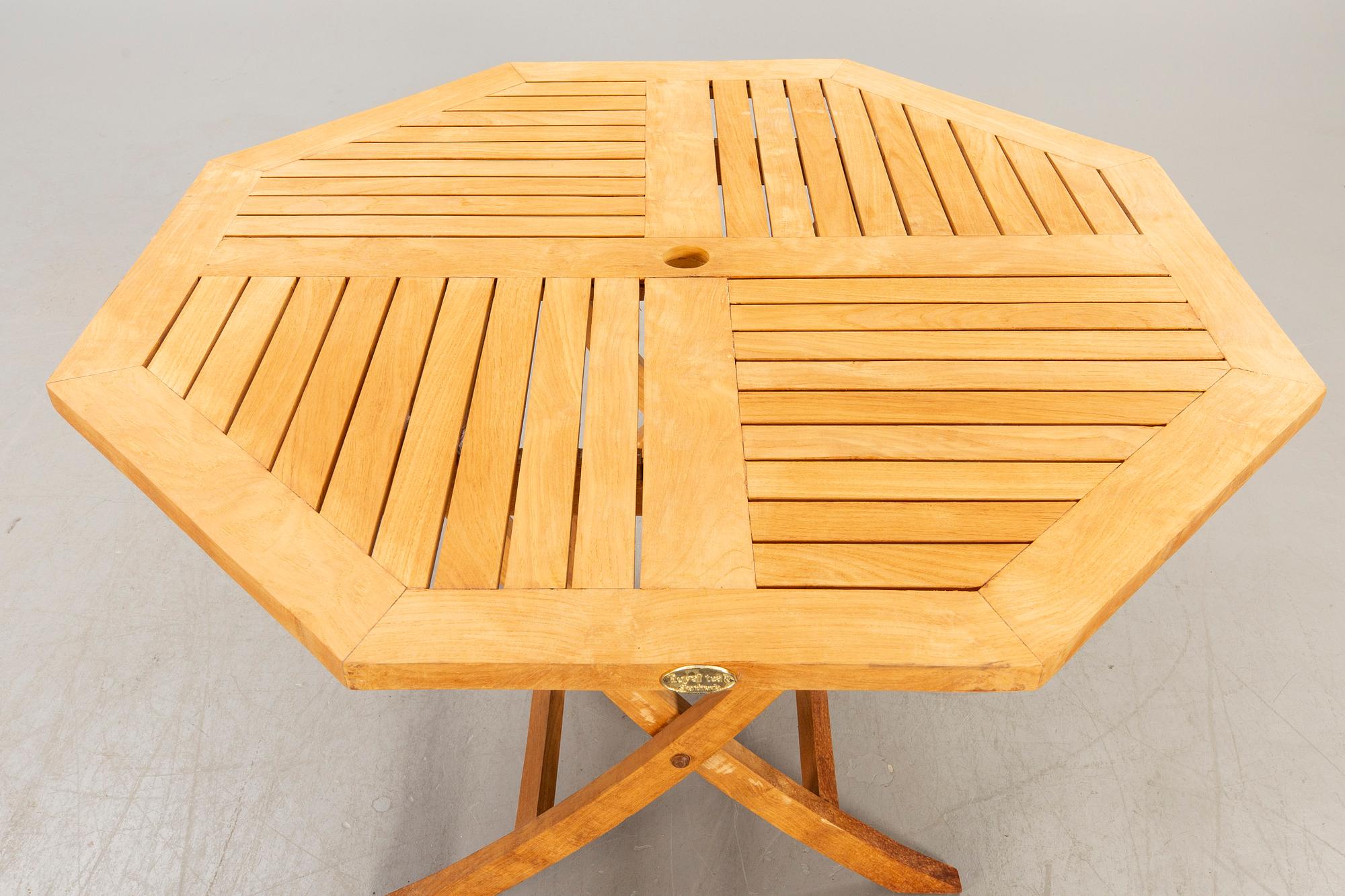 A set of four chairs and a table Royal teak and others, later part of the 20th century.