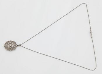 A platinum pendant set with old- and rose-cut diamonds.