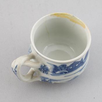 A set of six blue and white custard cups with covers,