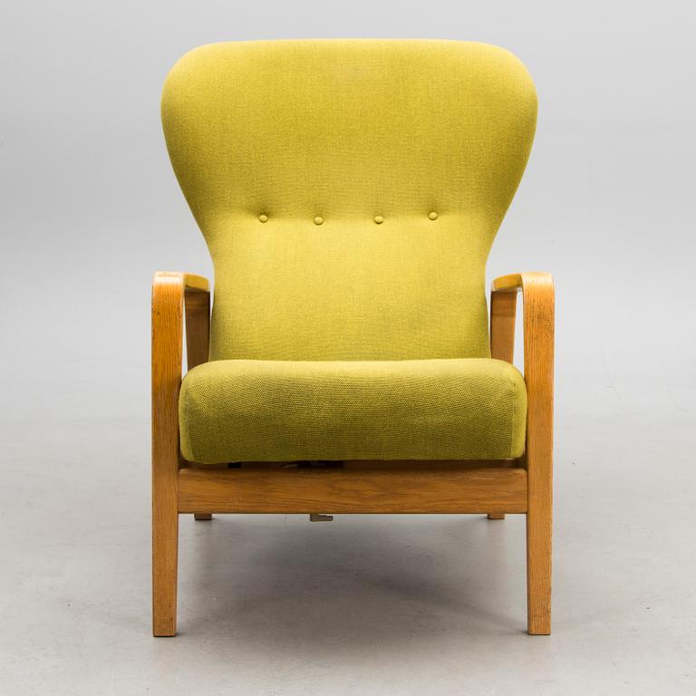 A 1960s 'Puck' armchair for Keravan Puusepäntehdas, Stockmann, Finland.
