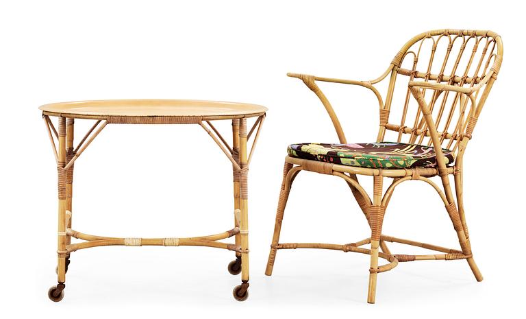 A rattan armchair and table attributed to Josef Frank, Svenskt Tenn.